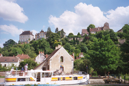 The view from our mooring an Chatel Censoir --  boats passing thru the lock and the hilltop village