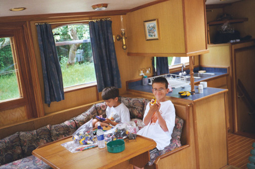 Patrick and Christopher at home inside the boat